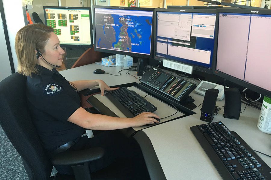 911 dispatcher Natalie Rumsby sits at her desk in Victoria where on April 24 she answered a call