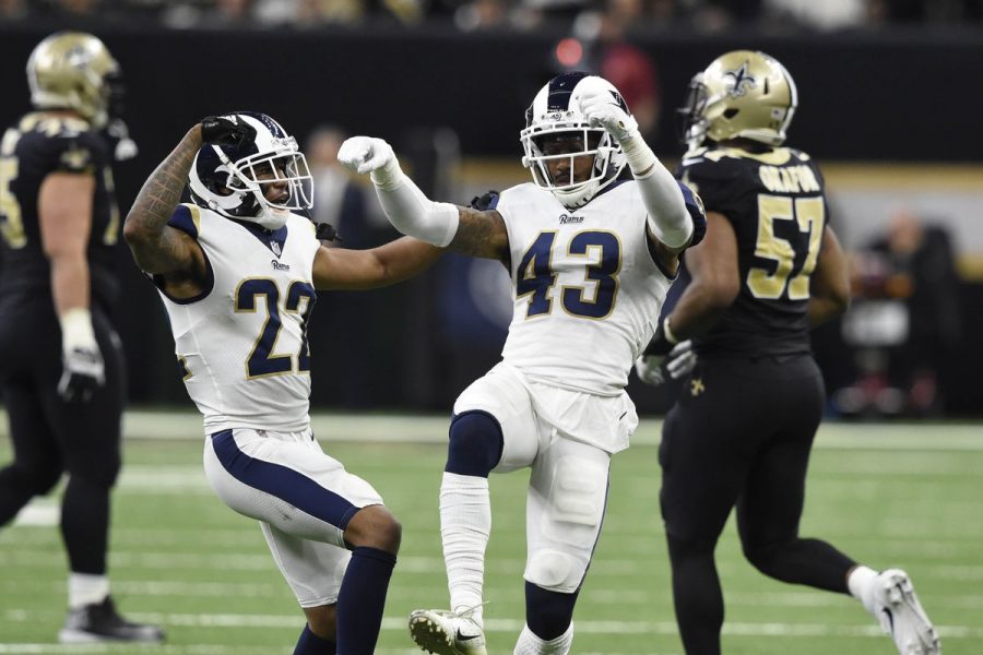 Todd Gurley blocks a player from the Saints, so they dont get the ball.