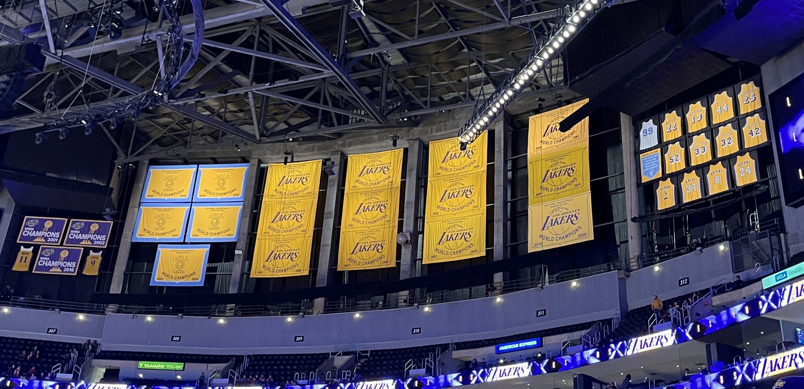 Los Angeles Lakers championship banners and retired jerseys hanging inside Crypto.com Arena.