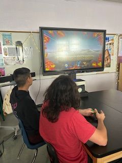 Students play Smash Bros in the Cards Boards N Cords Club